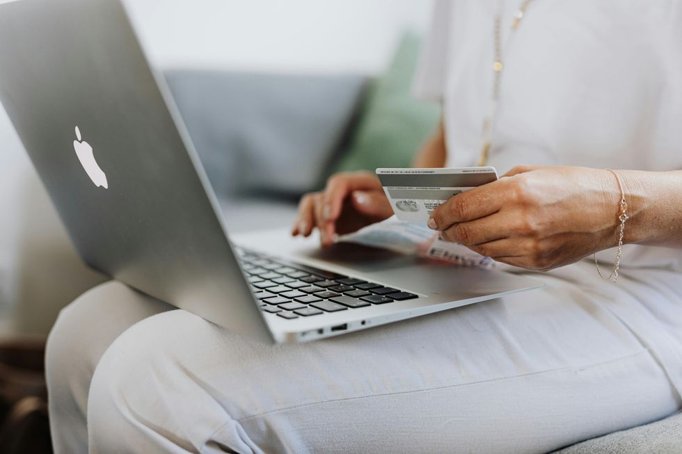 Woman holding bank card as she